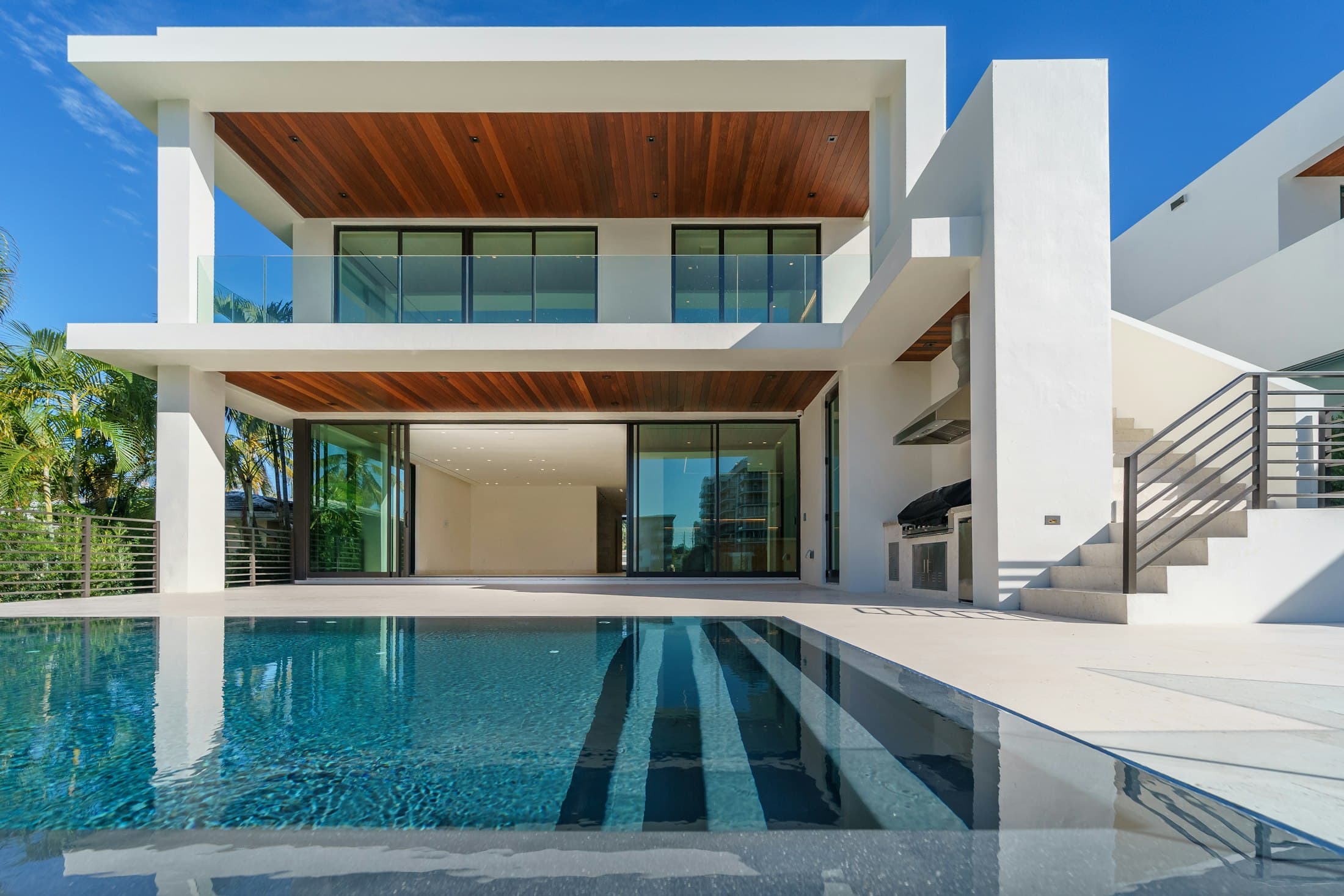 Contemporary villa with a private pool at dusk